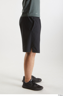 Yoshinaga Kuri  1 black shorts black sneakers dressed flexing…